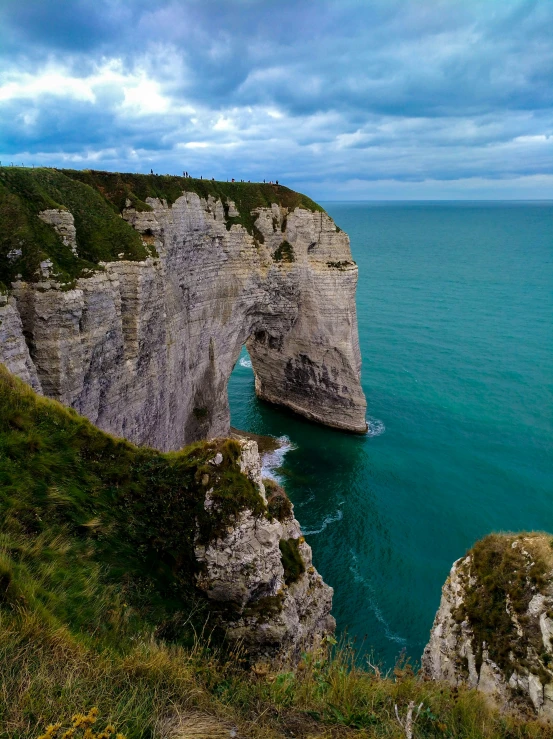 a large body of water with many cliffs near it