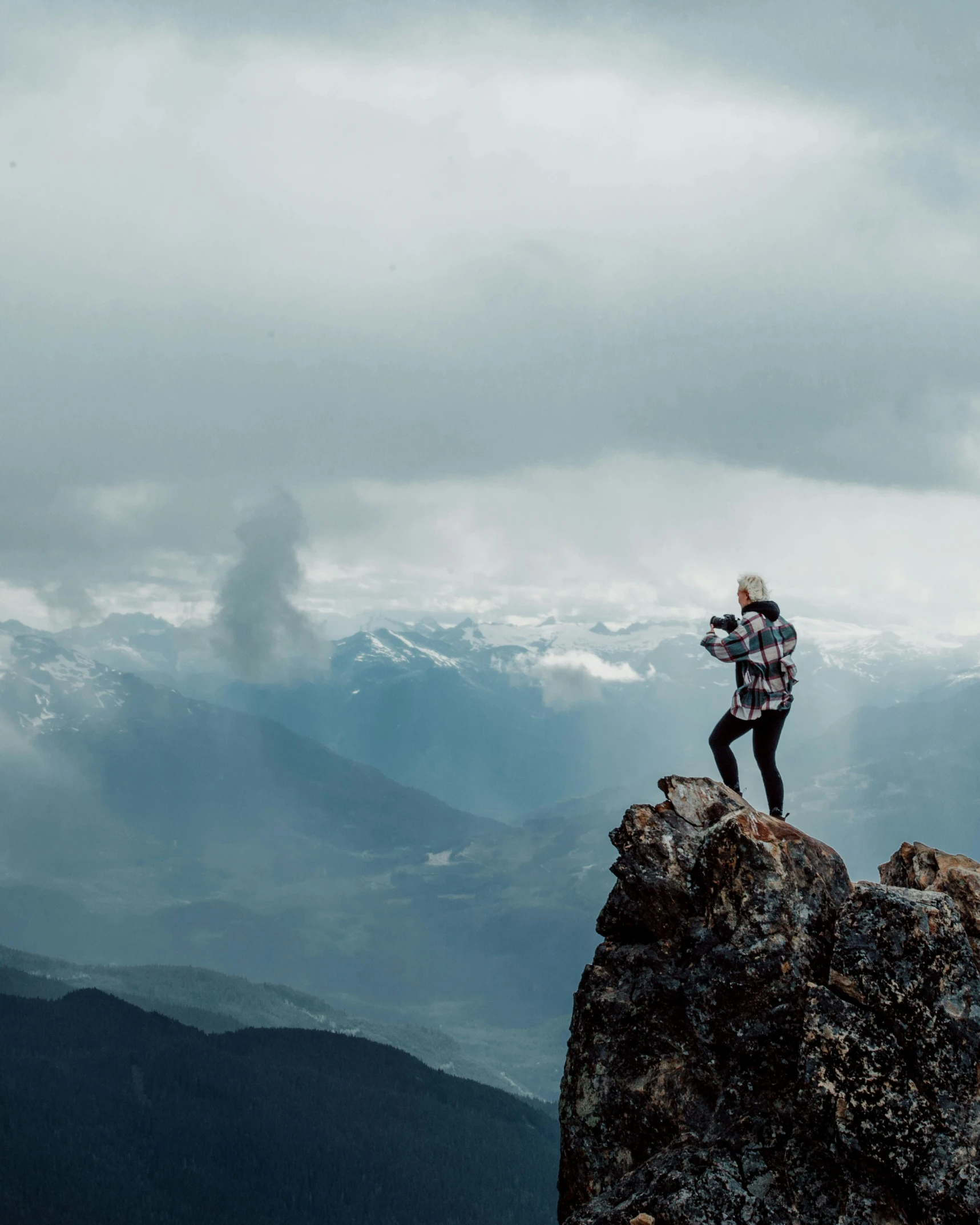 a person standing on top of a large mountain