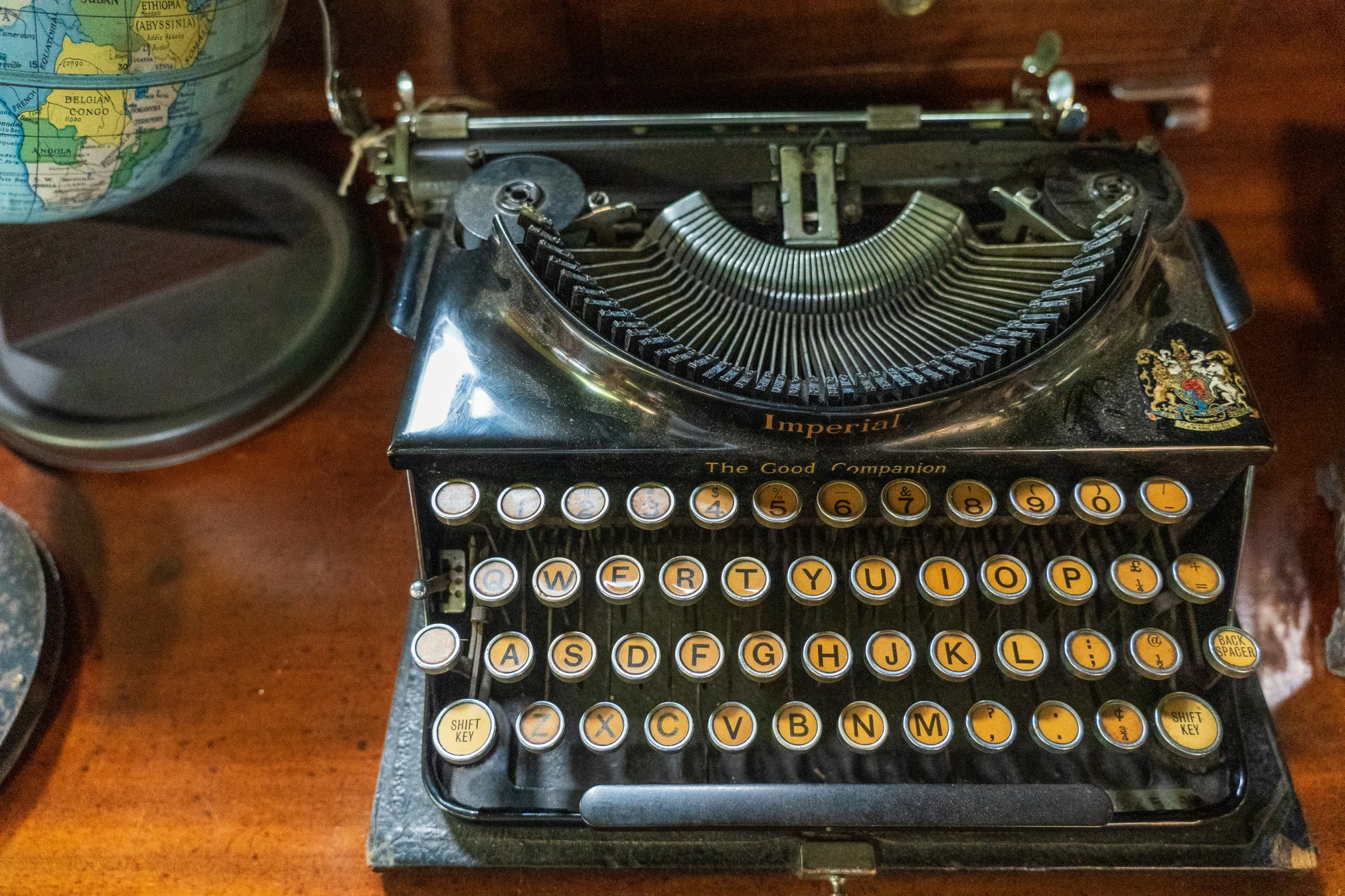 a close up of a vintage typewriter on a desk