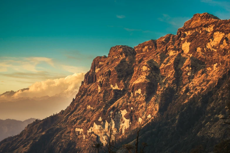 a long and majestic view of mountains in the afternoon light