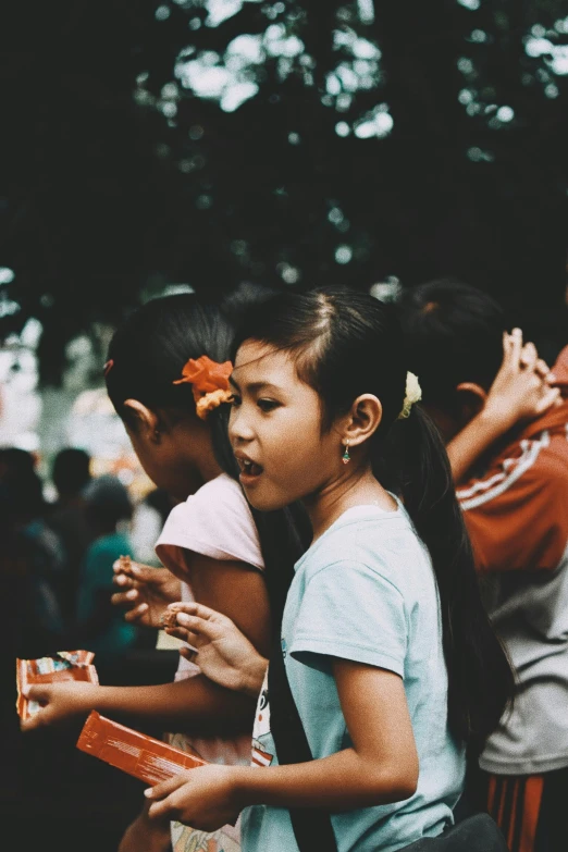 two little girls sitting next to each other