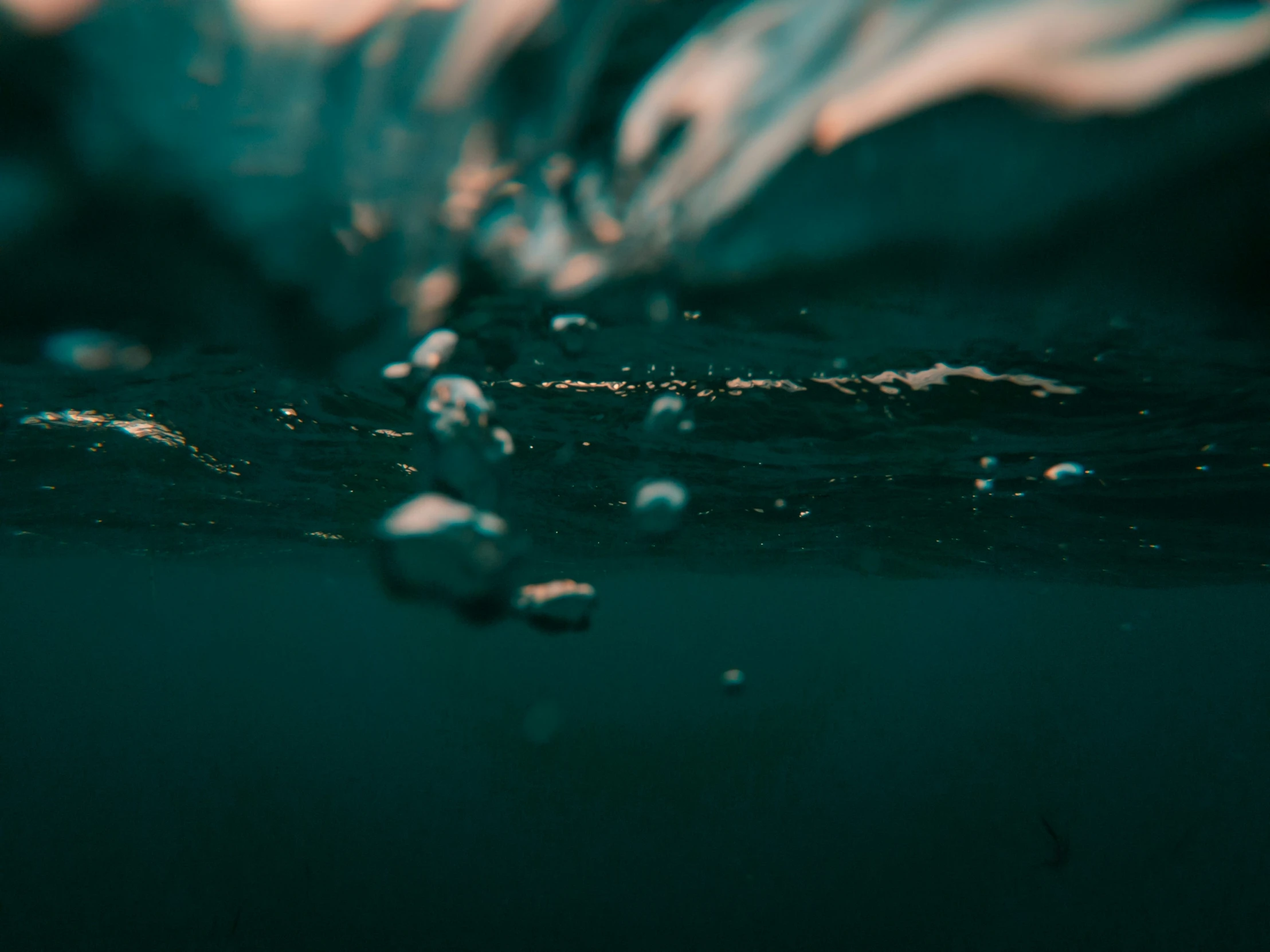 an up close view of the water with many bubbles