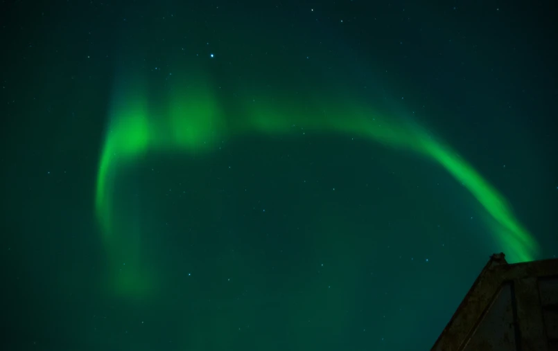 a green circle with bright lights in the night sky