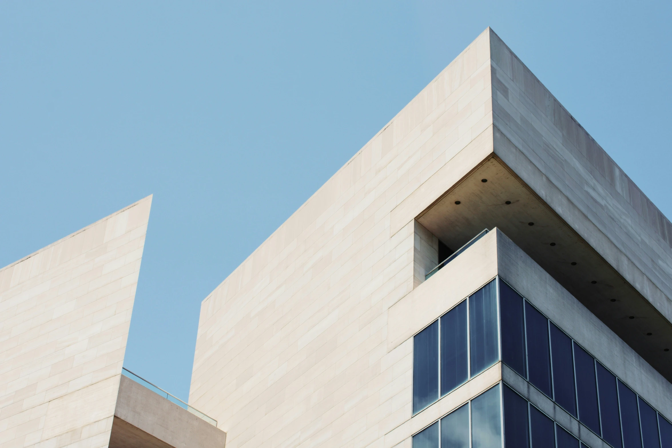 the building is gray with two windows