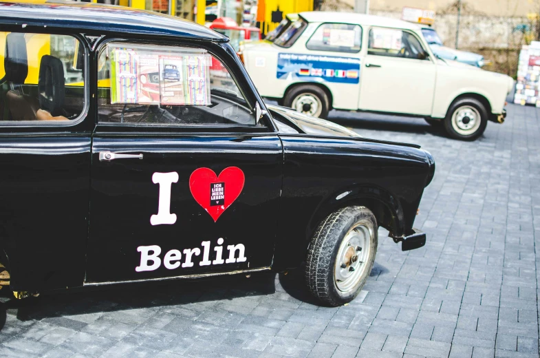 the back of a black car that has the word i love berlin on it