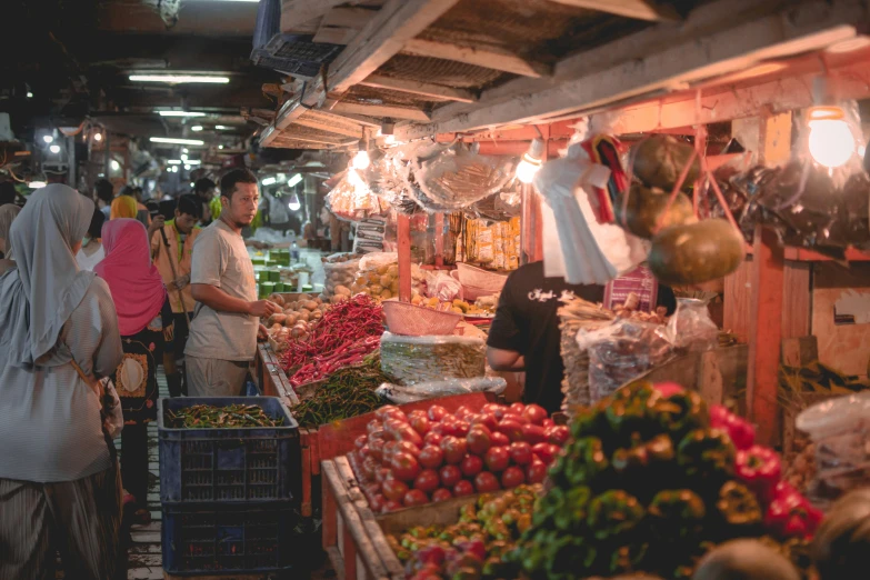 a market with people and produce for sale