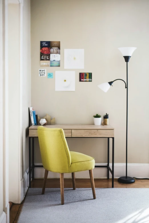 the desk is neatly kept, a chair sits by it