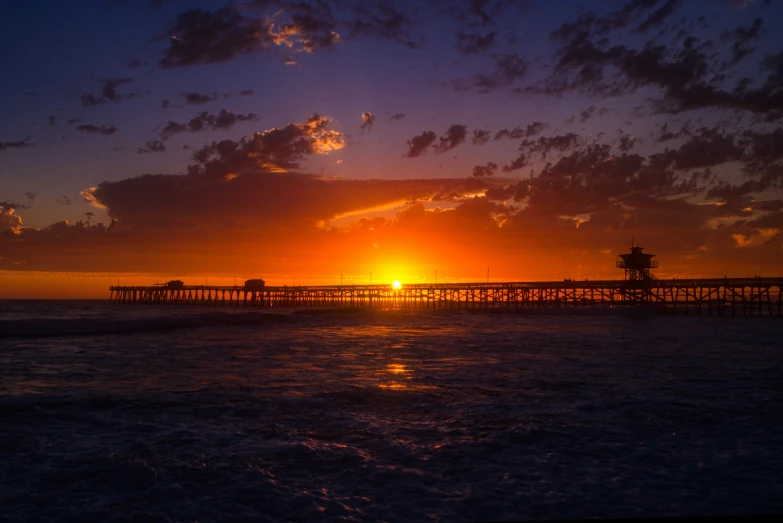 a pier during sunset on a very nice day