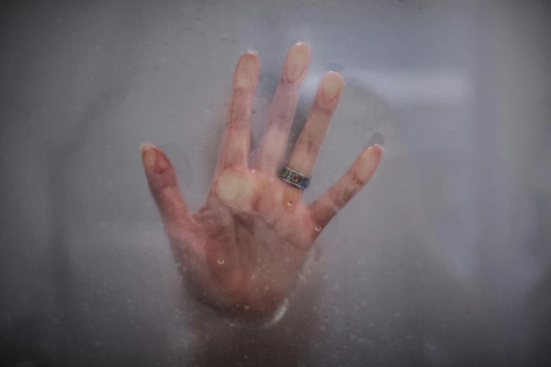 a woman's hand is shown in the water