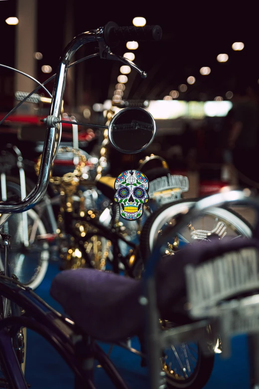 an antique motorcycle parked next to a purple chair