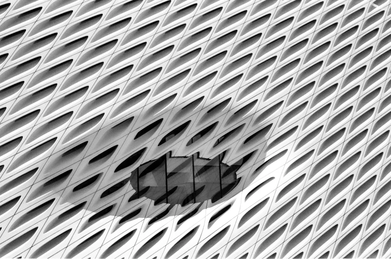 black and white image of a square hole in the side of a building