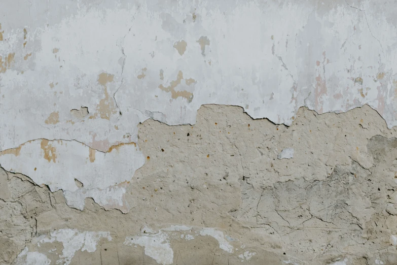a picture of a rusted cement surface with white stains