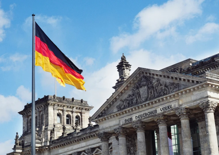 a very tall building with an german flag on it