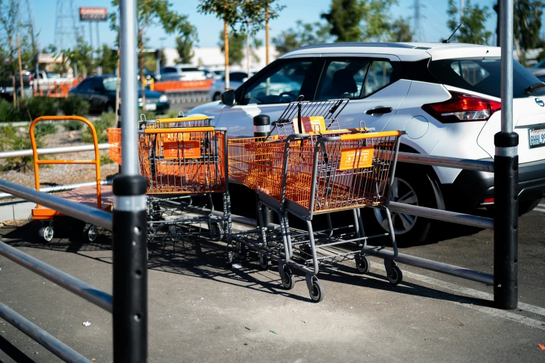 shopping carts are parked in a parking lot