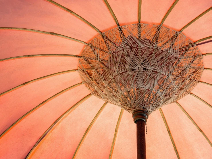 an umbrella is covered in woven wire