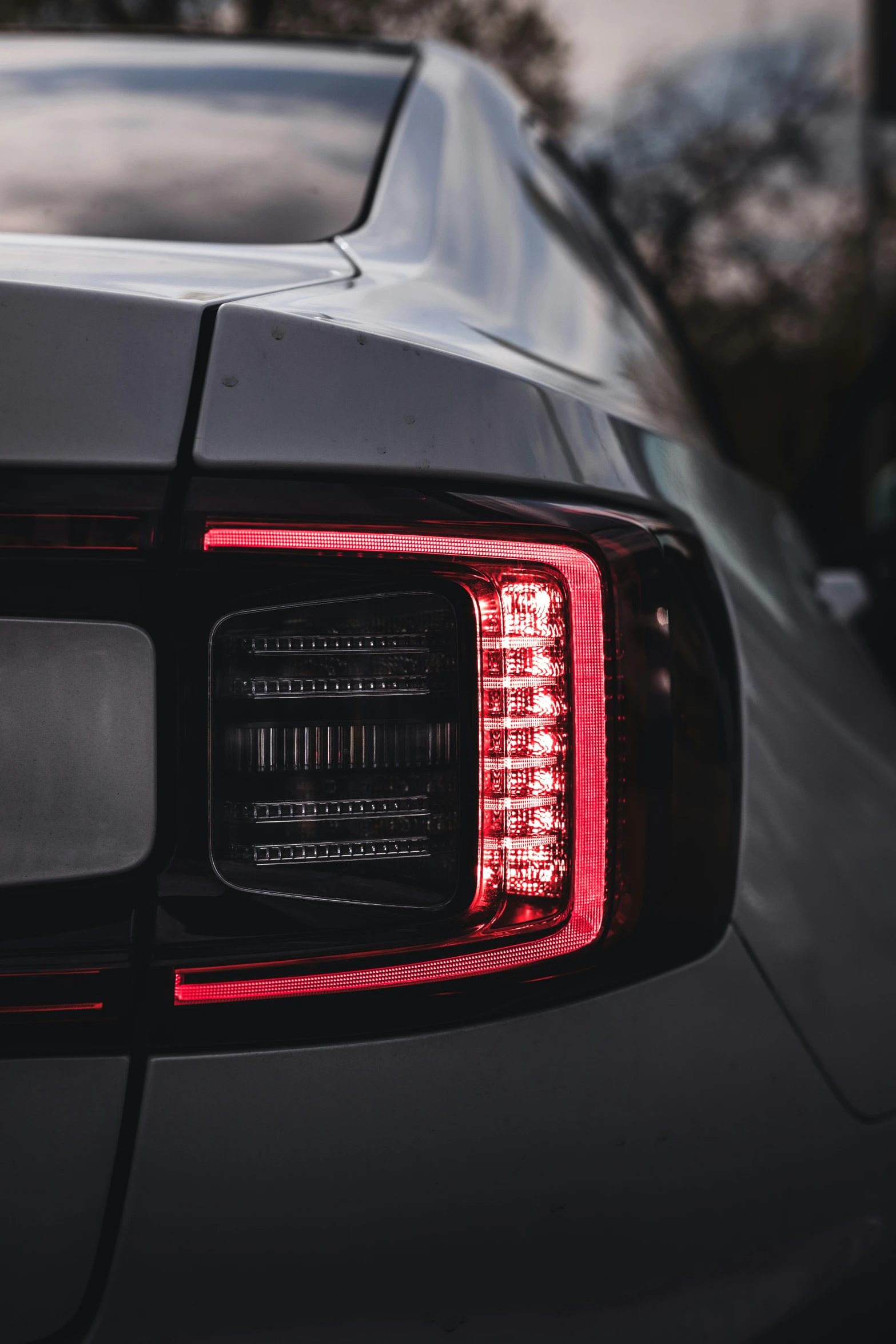 a view of a vehicle taillight with lights turned on