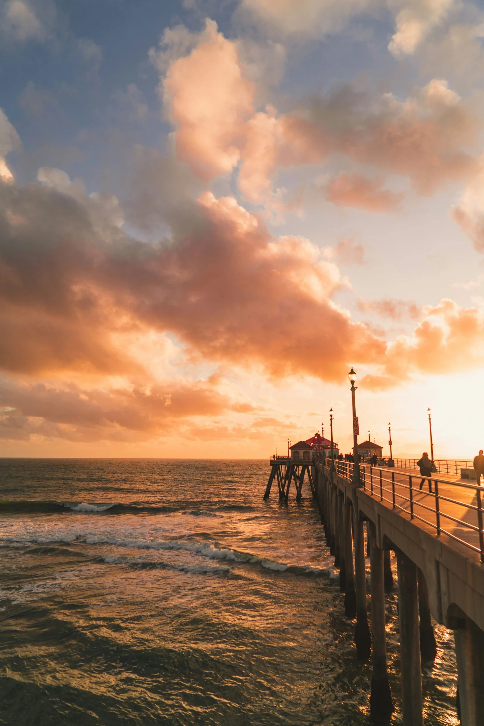 the ocean pier looks like it could have an ocean wave crashing over the pier