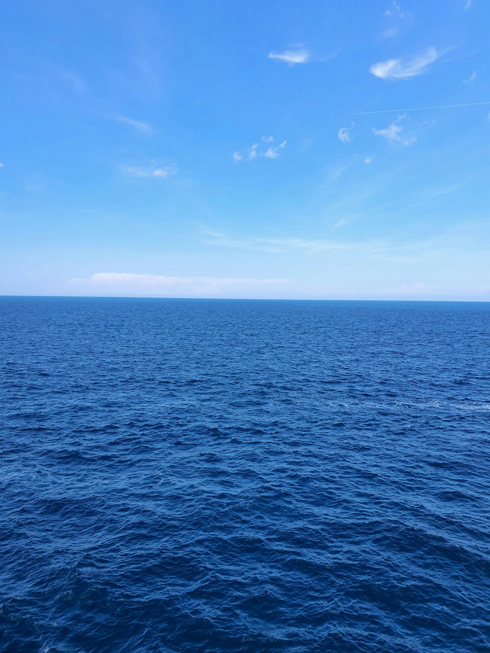 the calm ocean is very blue and clear