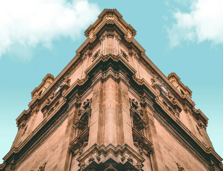 an ornate, detailed building with a sky background