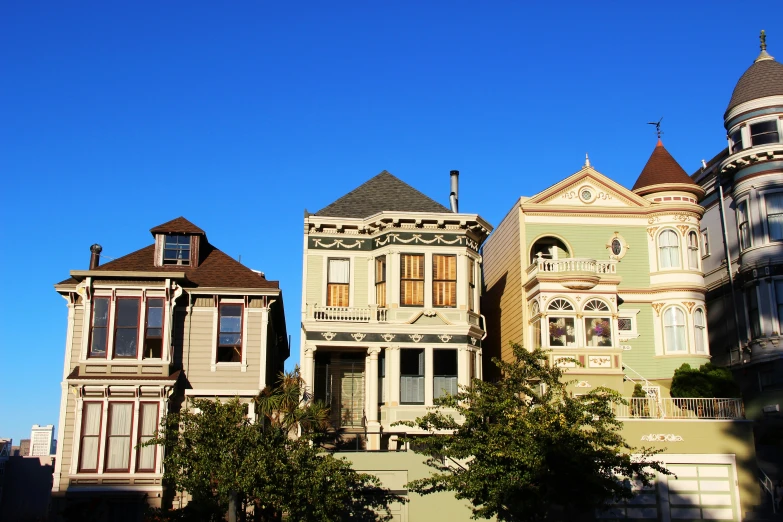 a house with many windows and a few trees