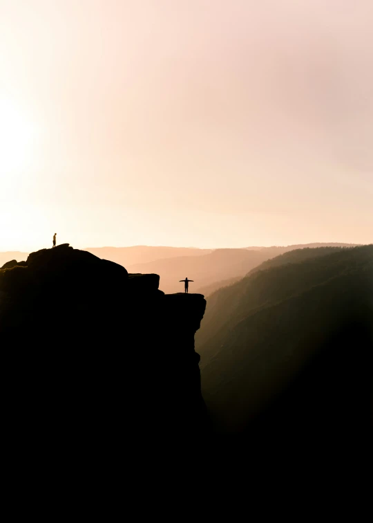 the cross is on top of a hill with two hills below