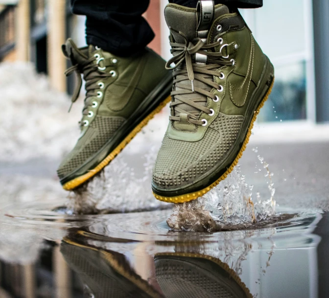 a person is wearing sneakers and water droplets