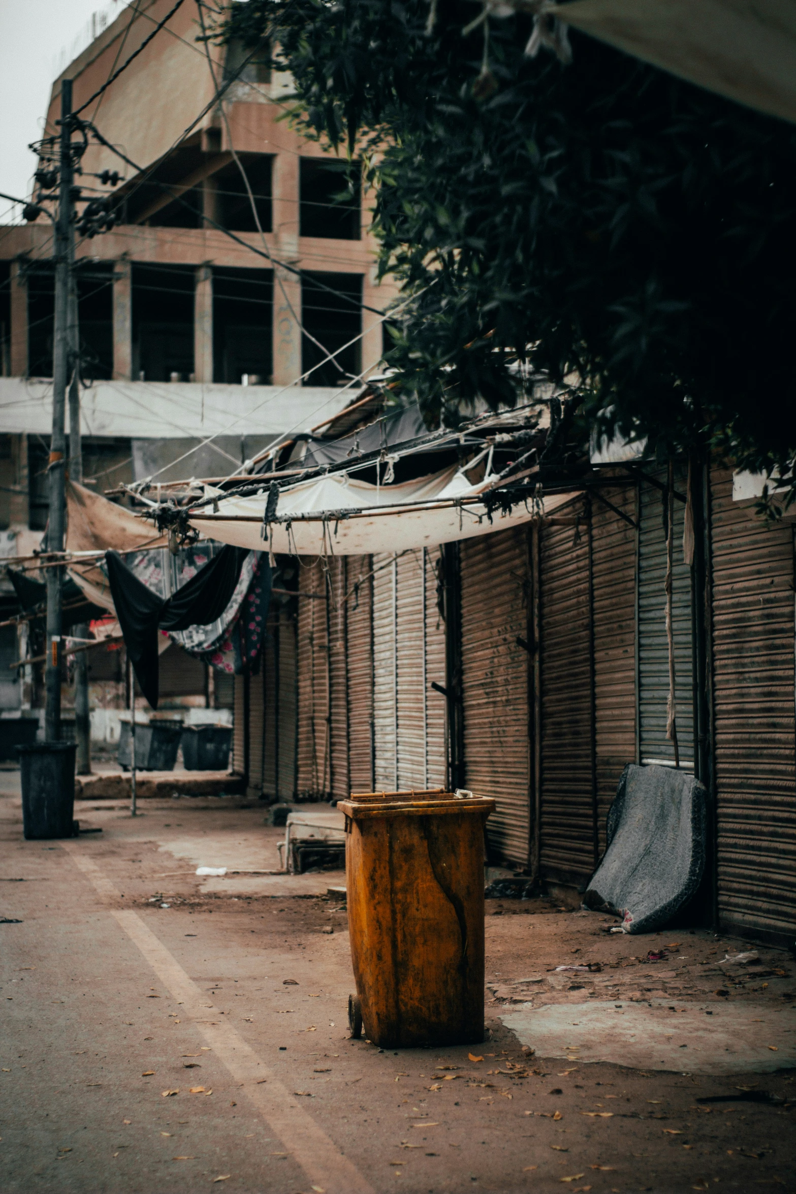 the buildings of a deserted neighborhood are boarded down