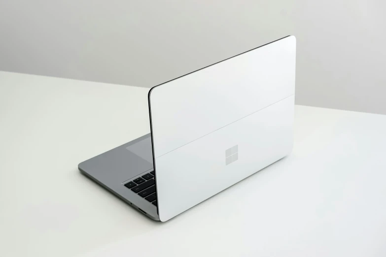 an apple laptop is shown on a white surface