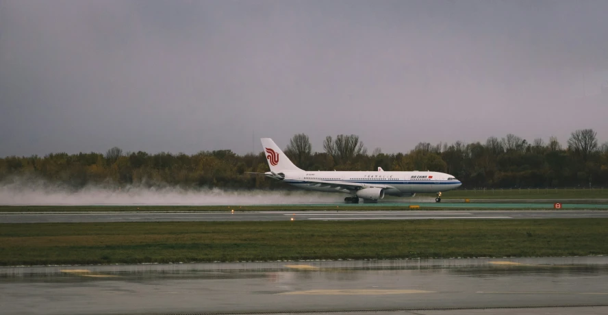 there is a airplane that is driving on the runway