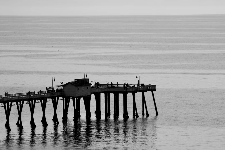 there is a pier that is near the beach