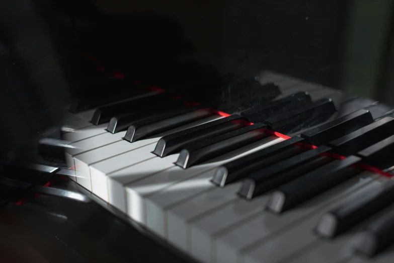 a close up image of a piano with a light in it