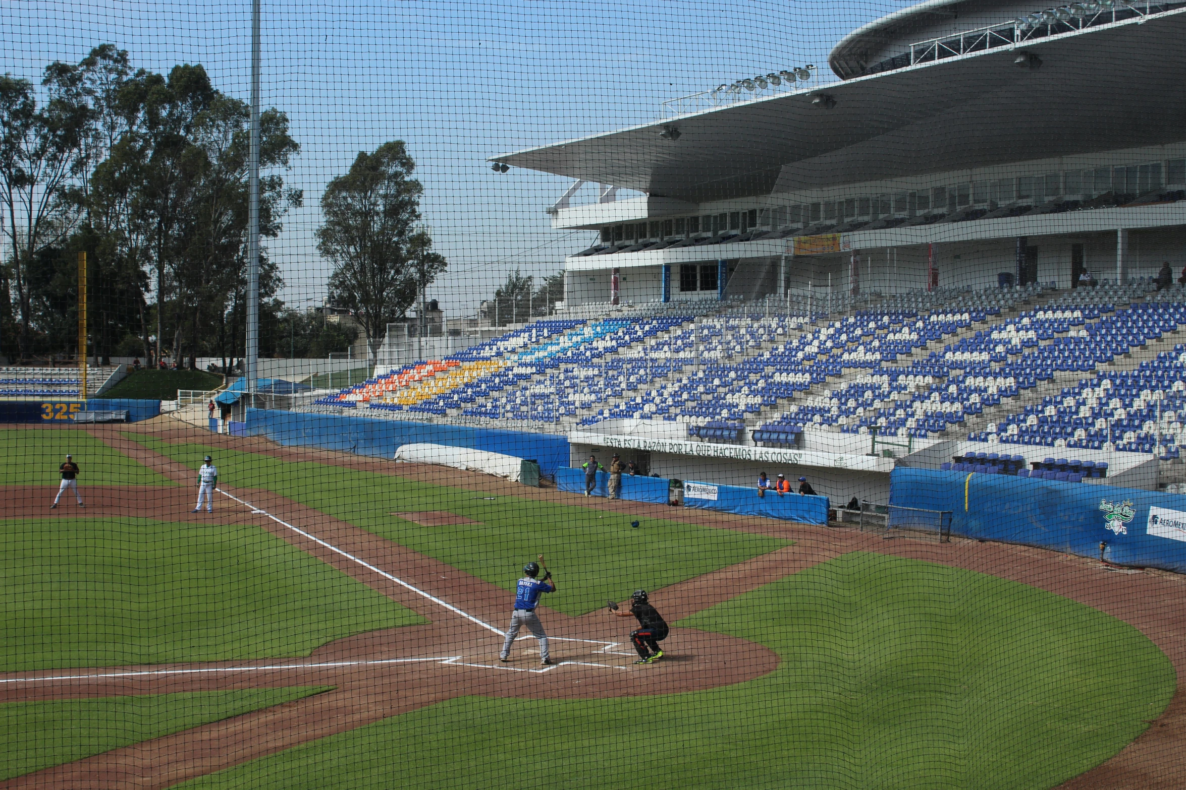 there are people playing baseball on the field