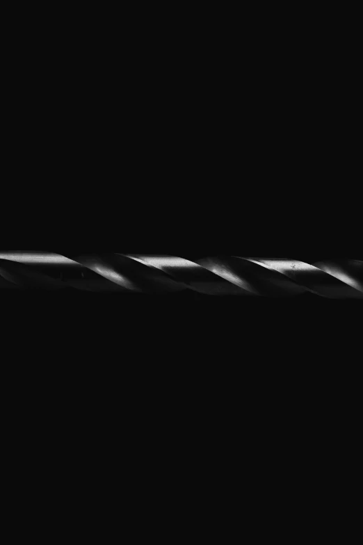an abstract po of a black object with white streaks