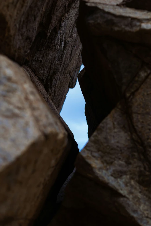 a black and white po of rocks and a sky background