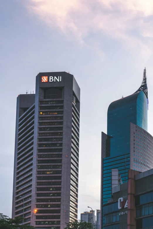 a building with the bni logo in front and a skyscr behind it