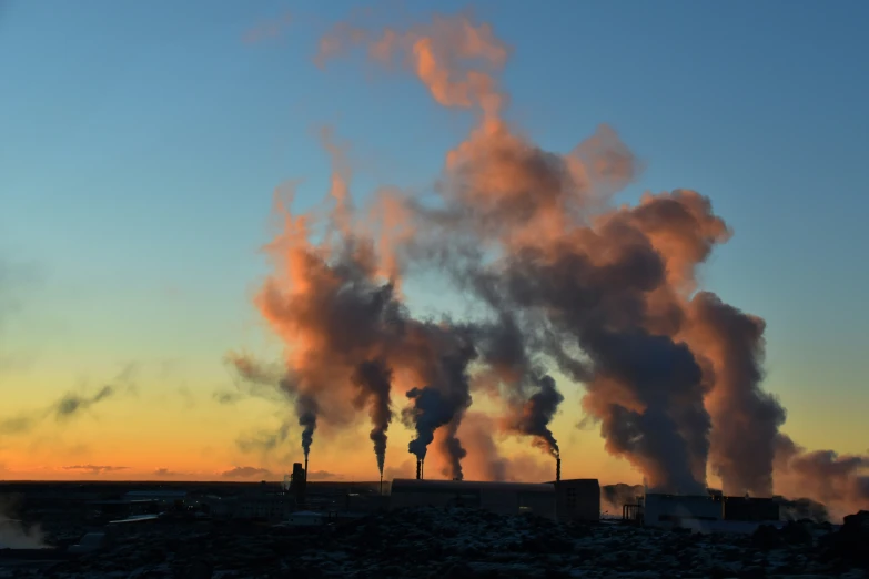 this is smoke from a factory with lots of steam pouring out