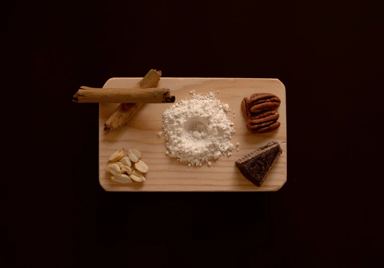 assortment of items displayed on wooden board displayed on table