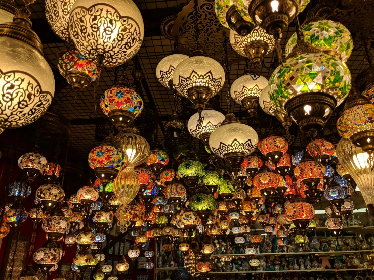 a display case filled with lamps and chandeliers