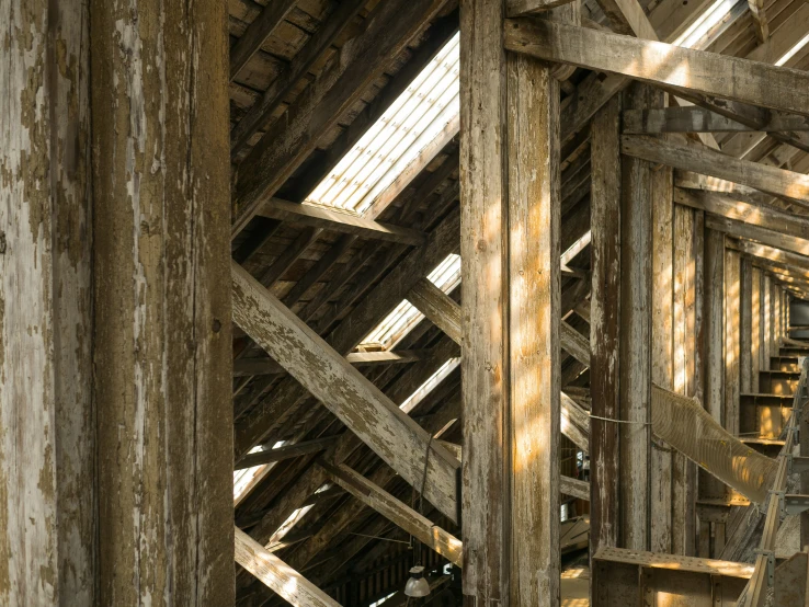 a large wooden structure that has a clock displayed on it