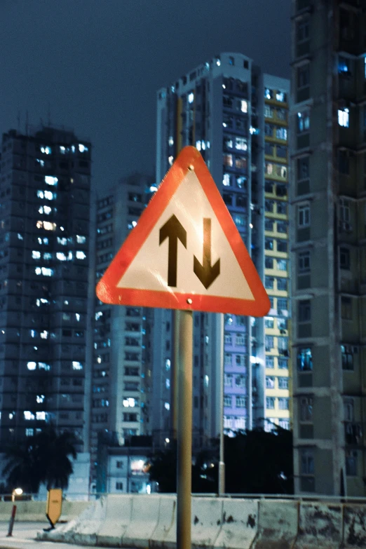 a street sign in front of some tall buildings
