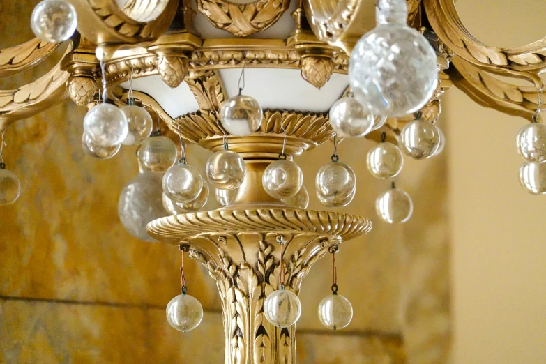 gold chandelier with large glass drops in ornate style