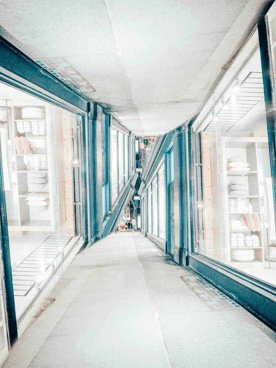 a narrow corridor between two mirrors and a staircase