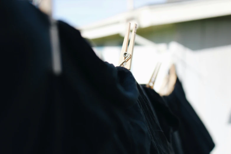 three clothing hang out on a clothes line