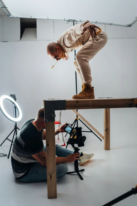 two men in a po studio preparing for an important video