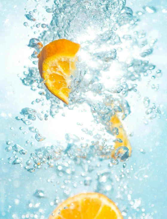 two pieces of orange are in the water