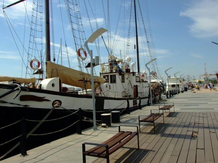 some large ships that are next to a dock