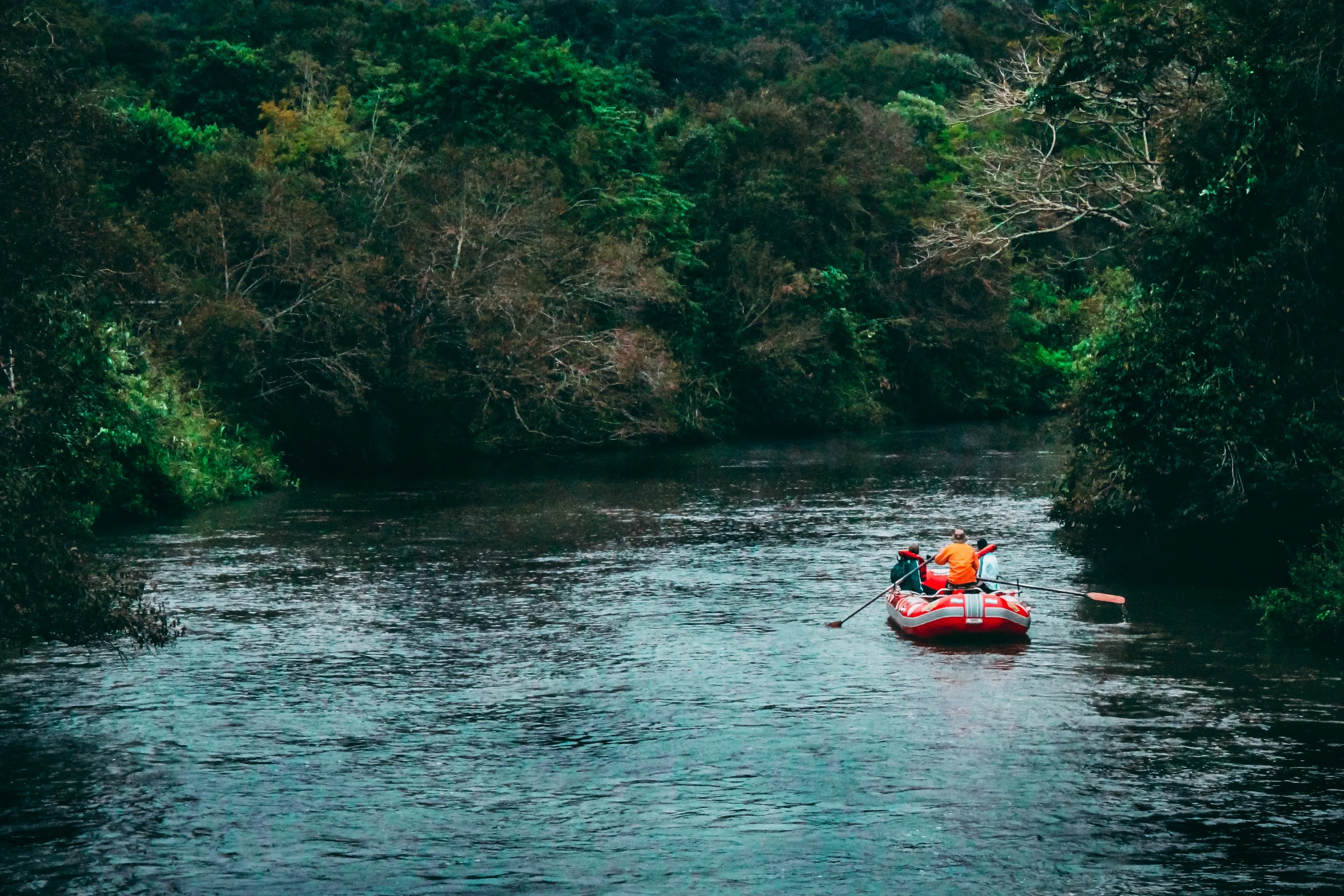 a couple in a raft on a river