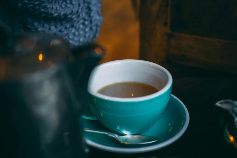 a teacup sits on top of the saucer