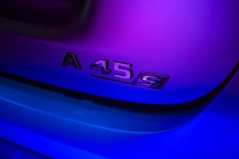 a close up of the emblem on the back of a purple car