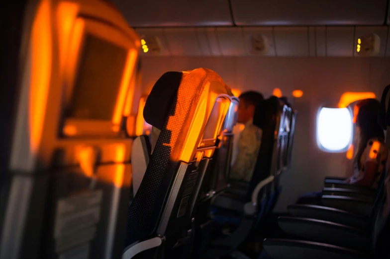 looking down an empty plane aisle in a plane